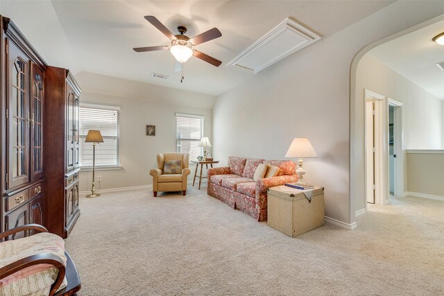 781 Bosley Dr, Fate, TX 75087 - carpeted living room featuring attic access, ceiling fan, baseboards, and arched walkways