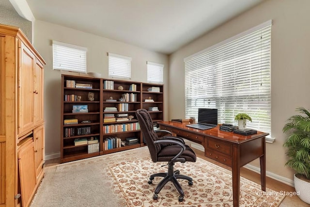 781 Bosley Dr, Fate, TX 75087 - office space with healthy amount of natural light, baseboards, and wood finished floors