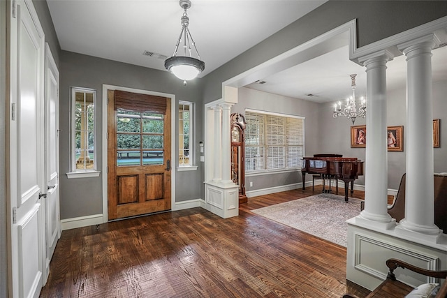 10040 Little Horn Cir, Frisco, TX 75035 - entrance foyer featuring healthy amount of natural light, dark wood-style floors, and decorative columns