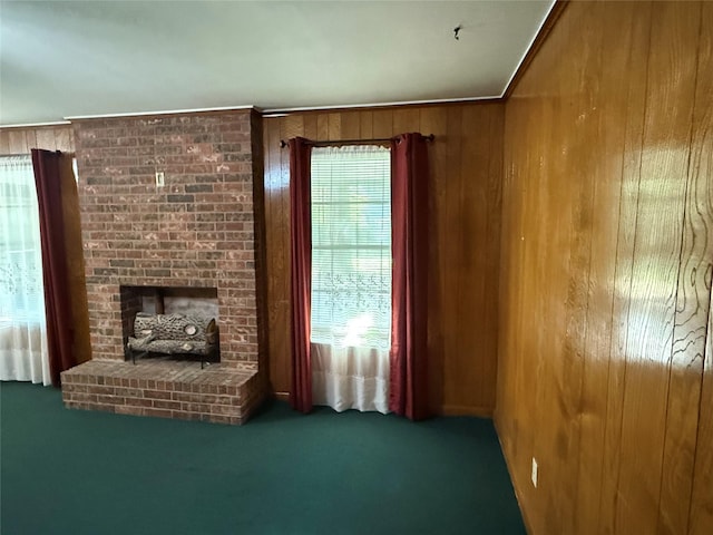 unfurnished living room with wood walls and carpet floors