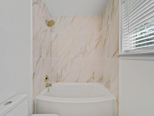 bathroom featuring toilet and shower / bathing tub combination