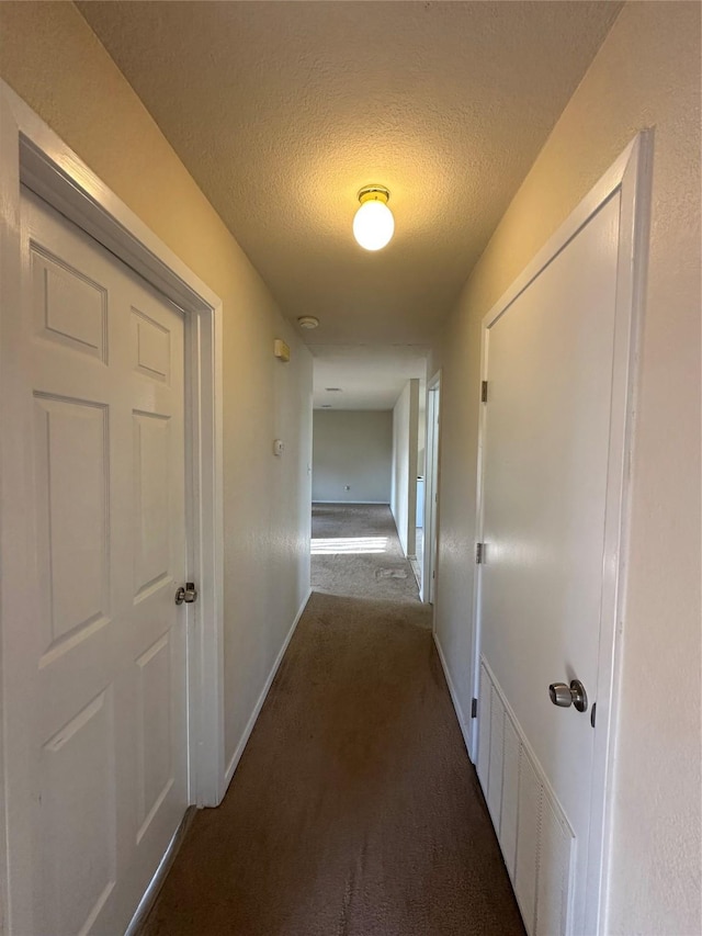 510 Green Acres Rd, Weatherford, TX 76088 - corridor with a textured ceiling, carpet flooring, baseboards, and visible vents
