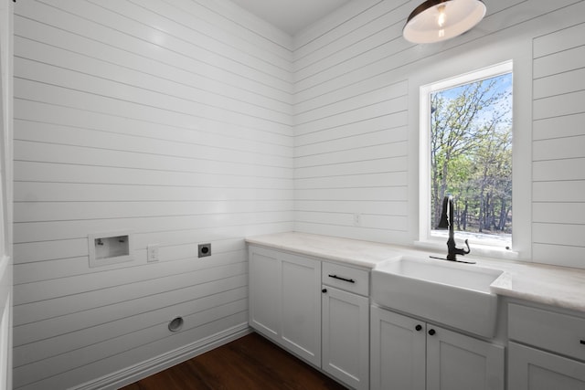 109 Post Oak Cv, Sunset, TX 76270 - laundry area with electric dryer hookup, washer hookup, a sink, dark wood-style floors, and cabinet space