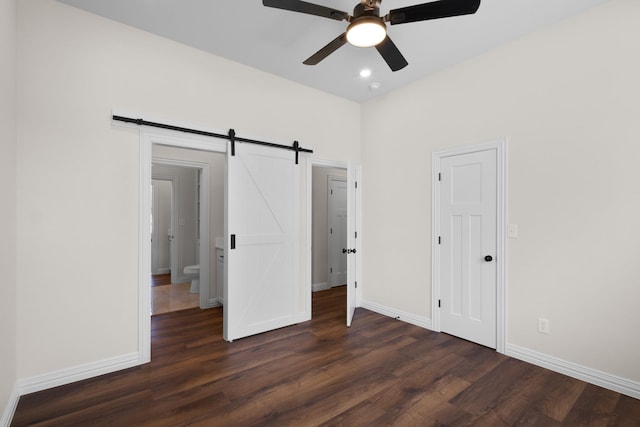 109 Post Oak Cv, Sunset, TX 76270 - unfurnished bedroom with baseboards, a barn door, a ceiling fan, dark wood finished floors, and recessed lighting