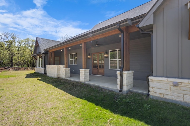 109 Post Oak Cv, Sunset, TX 76270 - back of house featuring board and batten siding, a patio, a lawn, and roof with shingles