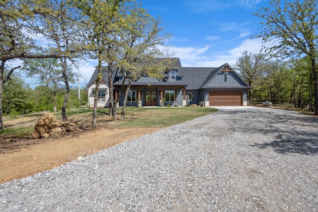 109 Post Oak Cv, Sunset, TX 76270 - view of front of property featuring board and batten siding, a front lawn, driveway, and roof with shingles
