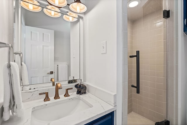 full bath featuring a stall shower and vanity