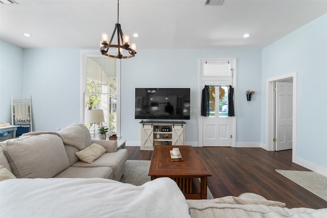 208 Corsicana St, Hillsboro, TX 76645 - living area with a chandelier, dark wood-style floors, baseboards, and recessed lighting