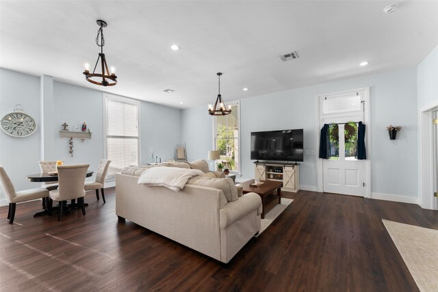 208 Corsicana St, Hillsboro, TX 76645 - living room with a chandelier, dark wood-style floors, recessed lighting, and baseboards