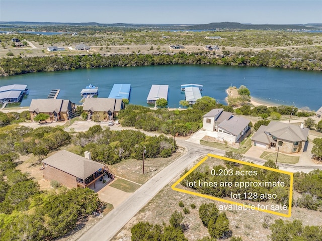 bird's eye view with a water view and a residential view