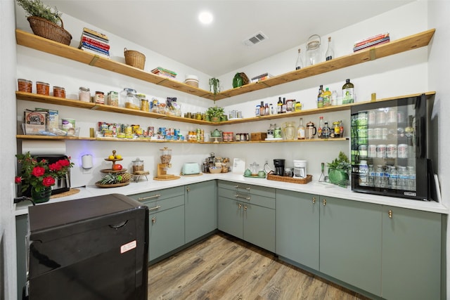 storage area featuring wine cooler and visible vents
