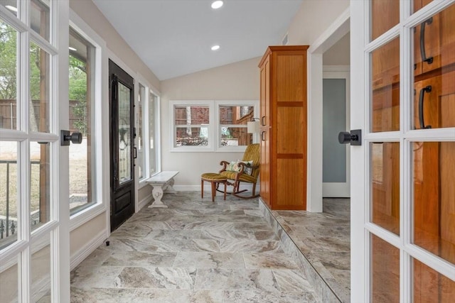 interior space featuring a wealth of natural light, recessed lighting, baseboards, and lofted ceiling