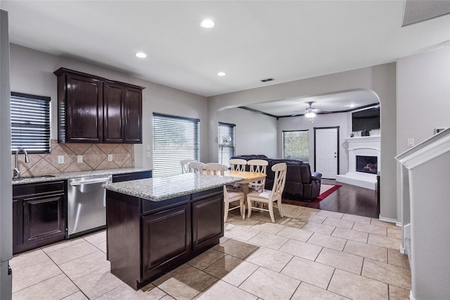 8312 White Hart Dr, Fort Worth, TX 76179 - kitchen with stainless steel dishwasher, arched walkways, a ceiling fan, recessed lighting, and a sink