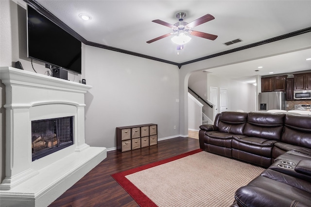 8312 White Hart Dr, Fort Worth, TX 76179 - living room with stairs, visible vents, ceiling fan, arched walkways, and wood finished floors