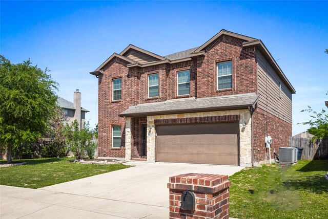 8312 White Hart Dr, Fort Worth, TX 76179 - view of front of property with cooling unit, a front yard, brick siding, an attached garage, and concrete driveway