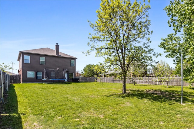 8312 White Hart Dr, Fort Worth, TX 76179 - view of yard with a fenced backyard and a trampoline