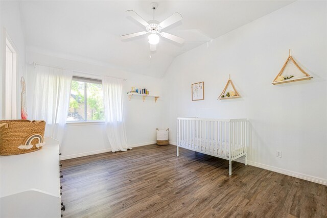 bedroom with a ceiling fan, baseboards, wood finished floors, and lofted ceiling