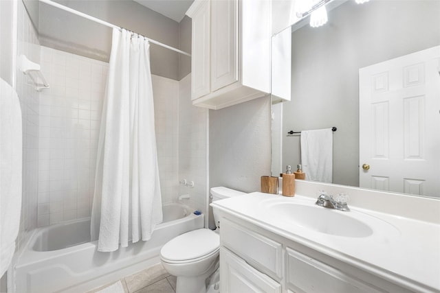 full bath featuring toilet, tile patterned floors, shower / bath combination with curtain, and vanity