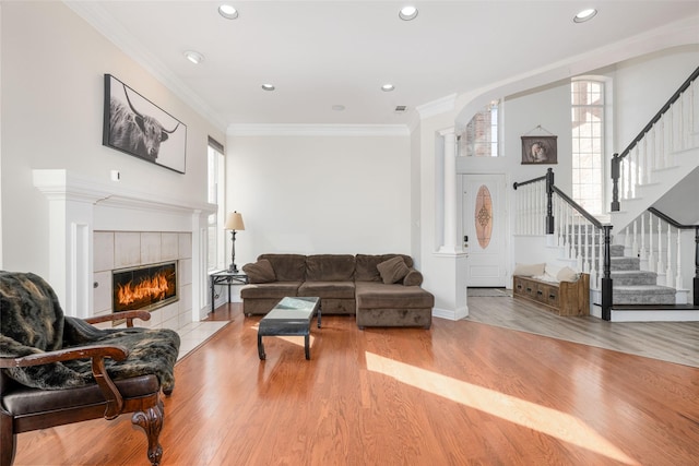 living room featuring stairway, recessed lighting, and wood finished floors
