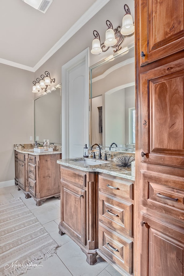 full bathroom featuring tile patterned floors, two vanities, a sink, and ornamental molding