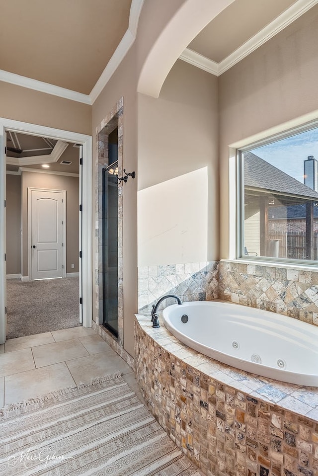 bathroom featuring a shower stall, crown molding, a whirlpool tub, and tile patterned flooring