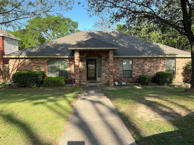 612 Desoto Dr, Desoto, TX 75115 - ranch-style home with roof with shingles, a front yard, and brick siding