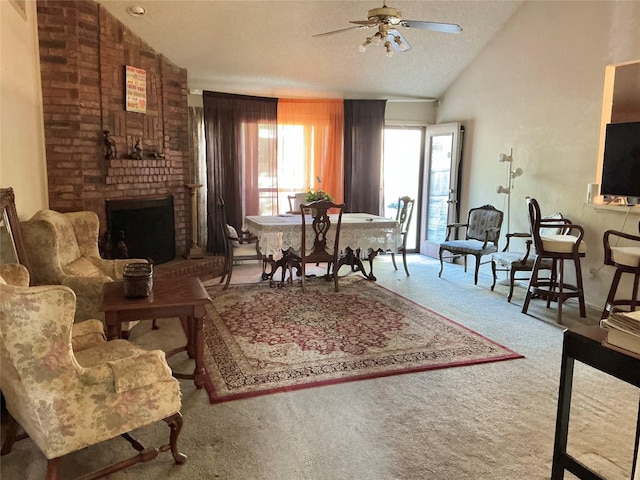 612 Desoto Dr, Desoto, TX 75115 - living area with a fireplace, carpet flooring, a textured ceiling, a ceiling fan, and lofted ceiling