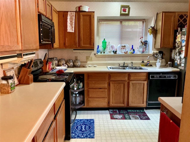 612 Desoto Dr, Desoto, TX 75115 - kitchen featuring light countertops, a sink, black appliances, and light floors