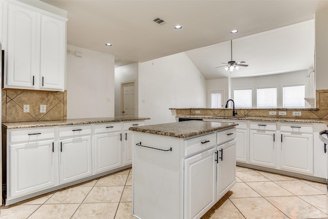 610 Crockett Dr, Lavon, TX 75166 - kitchen with tasteful backsplash, a peninsula, visible vents, and a sink