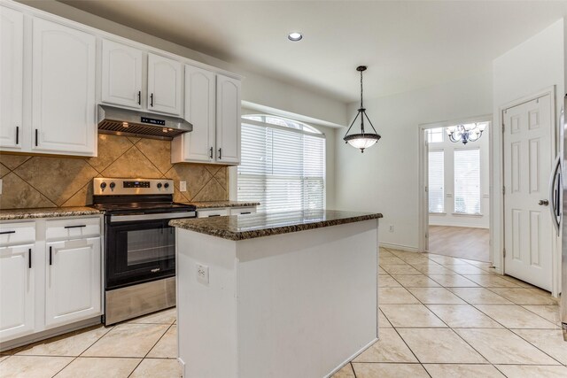 610 Crockett Dr, Lavon, TX 75166 - kitchen with stainless steel range with electric stovetop, under cabinet range hood, white cabinetry, decorative backsplash, and light tile patterned flooring