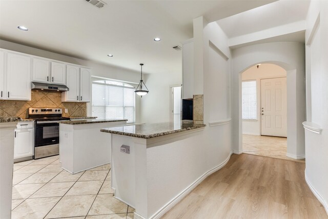 610 Crockett Dr, Lavon, TX 75166 - kitchen featuring white cabinetry, dark stone counters, electric stove, and under cabinet range hood