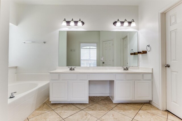 610 Crockett Dr, Lavon, TX 75166 - bathroom with a garden tub, double vanity, a sink, and tile patterned flooring