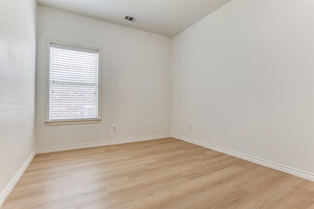 610 Crockett Dr, Lavon, TX 75166 - spare room featuring light wood-style floors, visible vents, and baseboards