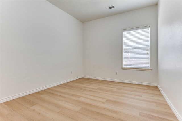 610 Crockett Dr, Lavon, TX 75166 - spare room with visible vents, baseboards, and wood finished floors