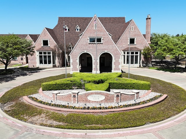 610 Crockett Dr, Lavon, TX 75166 - tudor-style house featuring curved driveway and brick siding