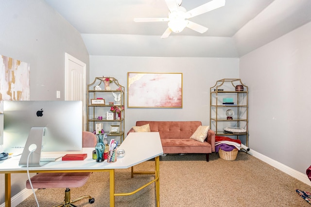 carpeted office space with baseboards, a ceiling fan, and vaulted ceiling