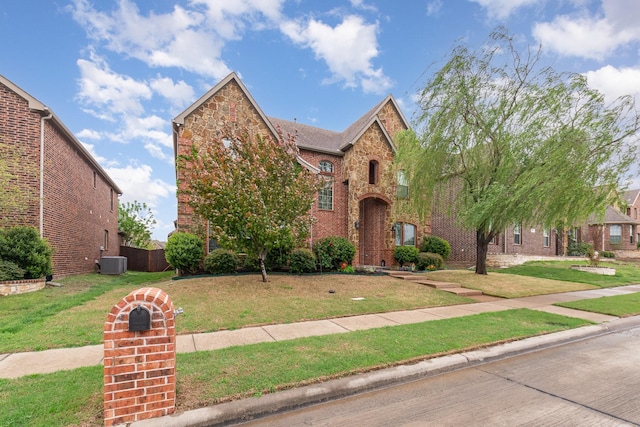 3608 Bright Star Way, Plano, TX 75074 - view of front of house featuring cooling unit, brick siding, and a front lawn