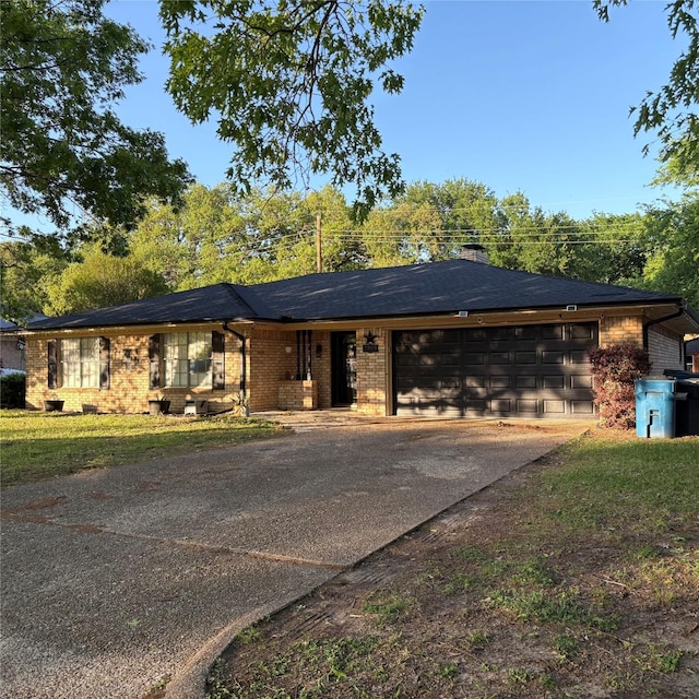 2909 Oakridge Dr, Corsicana, TX 75110 - ranch-style home with an attached garage, concrete driveway, brick siding, and a chimney