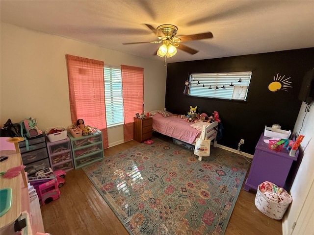 2909 Oakridge Dr, Corsicana, TX 75110 - bedroom featuring wood finished floors and a ceiling fan