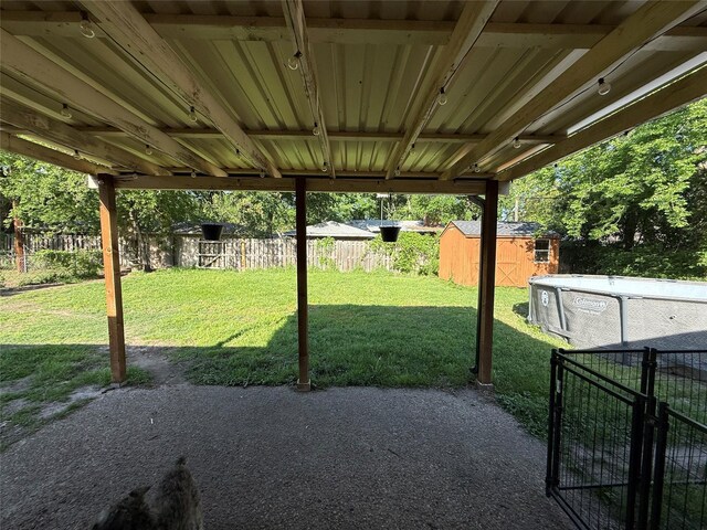 2909 Oakridge Dr, Corsicana, TX 75110 - view of yard with a shed, a patio area, and an outdoor structure
