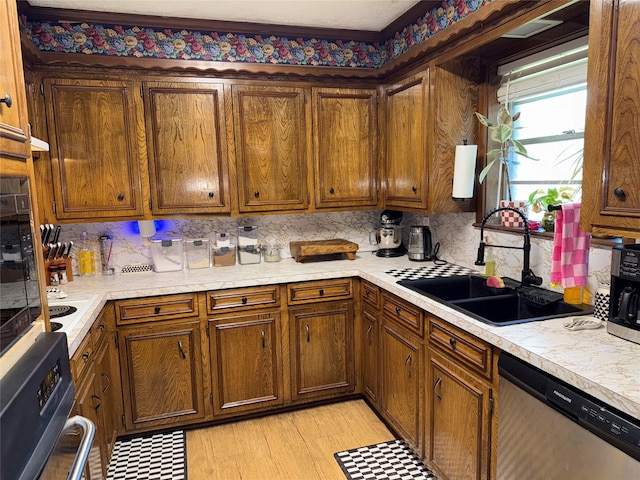 2909 Oakridge Dr, Corsicana, TX 75110 - kitchen with appliances with stainless steel finishes, a sink, light countertops, and backsplash