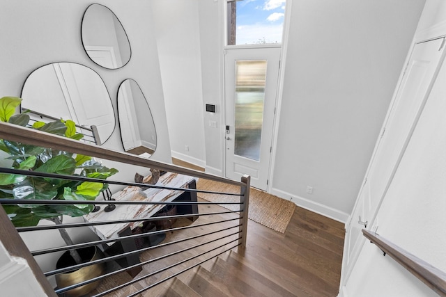 entryway featuring wood finished floors and baseboards