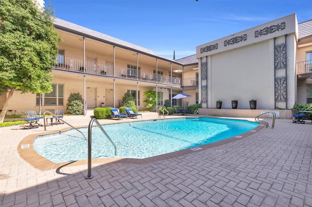 6126 Averill Way Unit 203W, Dallas, TX 75225 - community pool featuring a patio