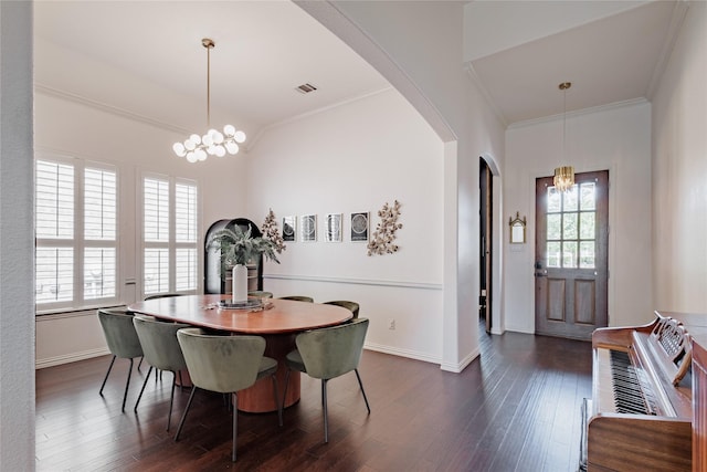 4300 Round Valley Ln, Fort Worth, TX 76262 - dining area with a chandelier, arched walkways, crown molding, and dark wood finished floors