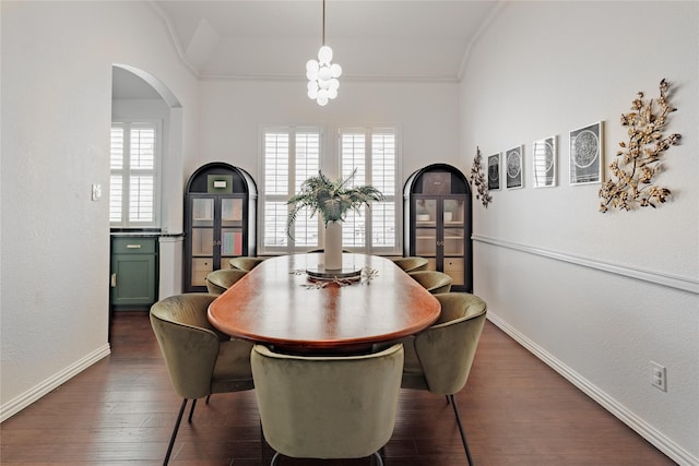4300 Round Valley Ln, Fort Worth, TX 76262 - dining space with ornamental molding, arched walkways, baseboards, and dark wood-style floors