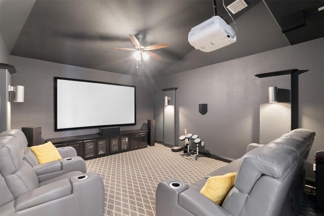 1128 Ellicott Dr, Celina, TX 75009 - cinema featuring ceiling fan, vaulted ceiling, carpet floors, a textured wall, and baseboards