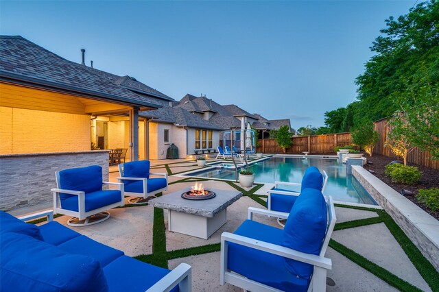 1128 Ellicott Dr, Celina, TX 75009 - view of pool featuring an outdoor living space with a fire pit, a patio, a fenced backyard, and a pool with connected hot tub