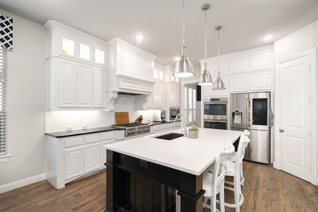 1128 Ellicott Dr, Celina, TX 75009 - kitchen with appliances with stainless steel finishes, a sink, white cabinets, and recessed lighting
