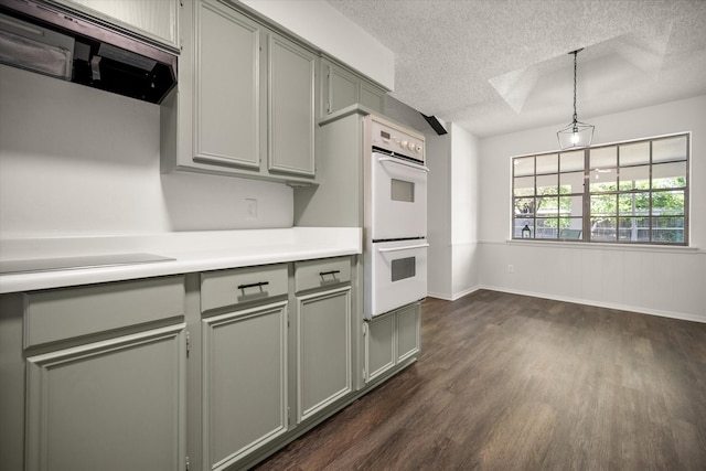 6516 Welch Ave, Fort Worth, TX 76133 - kitchen with double oven, gray cabinets, a textured ceiling, dark wood finished floors, and exhaust hood