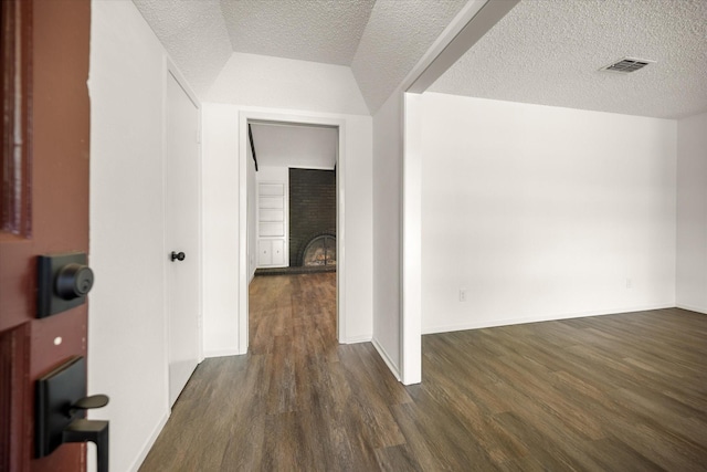 6516 Welch Ave, Fort Worth, TX 76133 - additional living space featuring wood finished floors, a fireplace, a textured ceiling, and baseboards